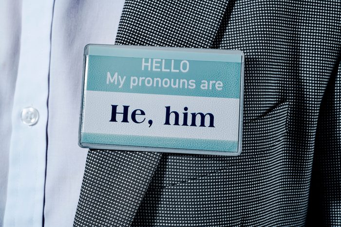 text hello my pronouns are he, him in his lapel