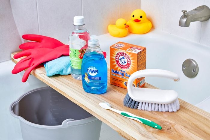 Bathtub cleaning products above tub