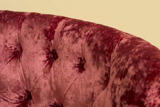 close up of a red velvet couch