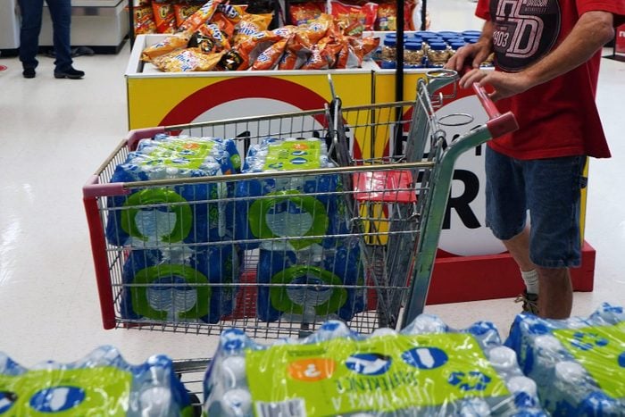 a cart filled with cases of bottled water
