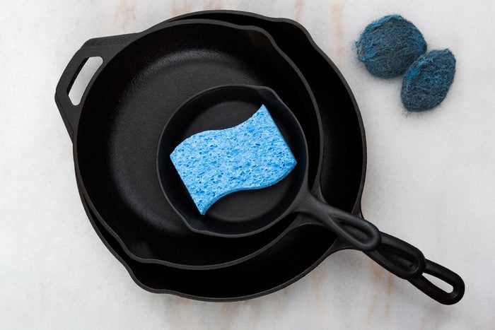 Cast Iron Cookware with cleaning supplies