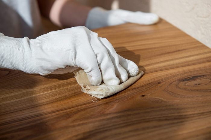 Coating wood with oil. Impregnation of wooden countertops. Close-up