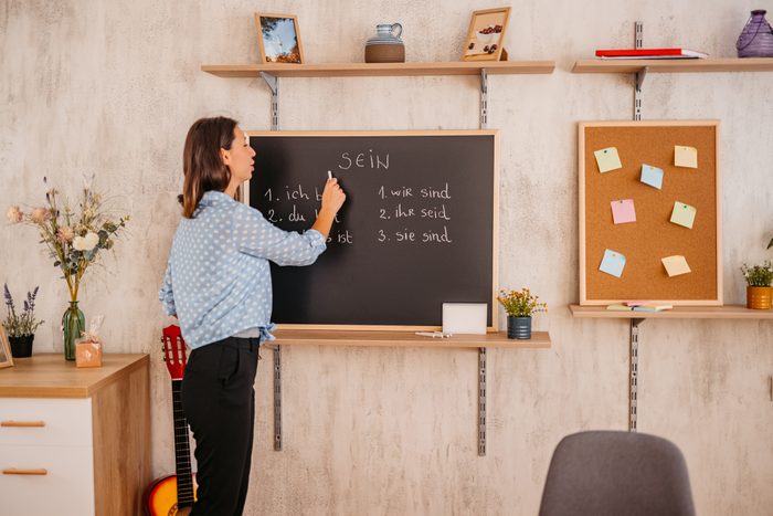 Female teacher giving German language lesson online