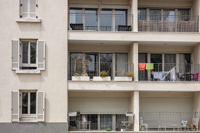 Apartment building in Mediterranean city in bright sunlight, full frame