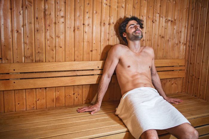 Young man in sauna.