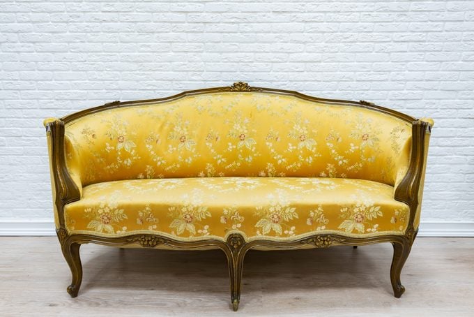 Old vintage silk luxury sofa.