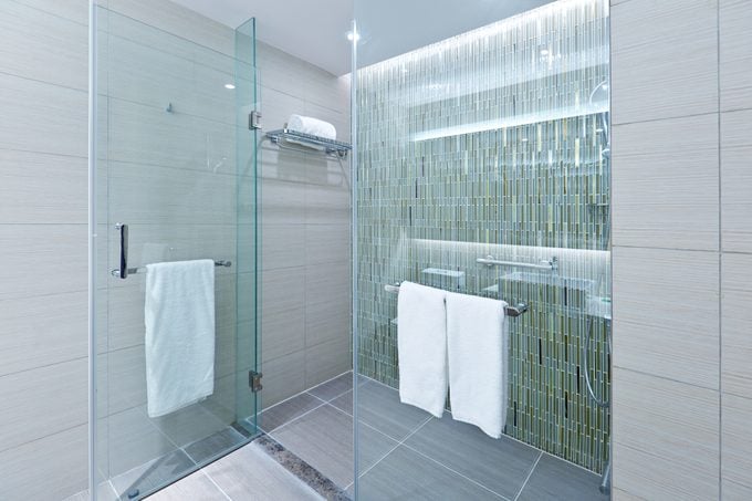 Contemporary shower with glass tile mosaic