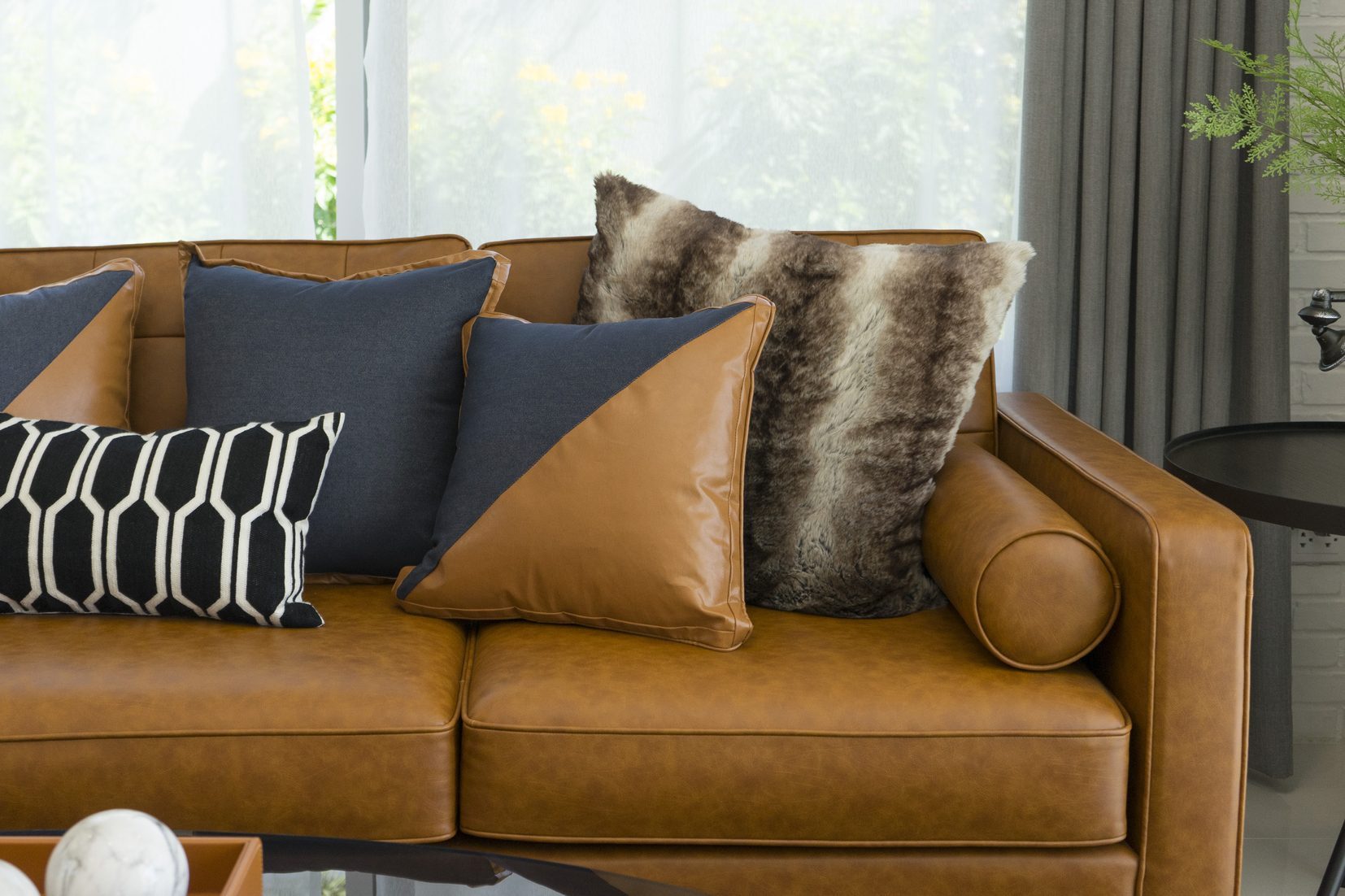 pillow on leather sofa