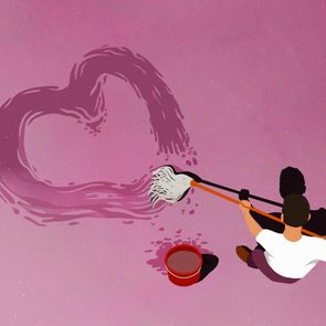 Man drawing heart-shape with mop