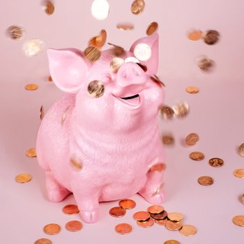 Piggy Coin Bank with falling pennies