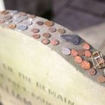 If You See a Coin on a Gravestone, This Is What It Means
