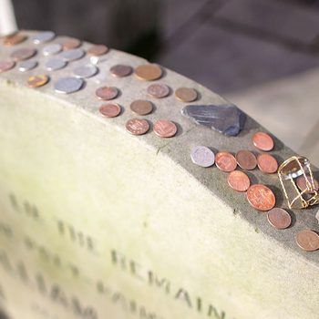 Coins are left on top of the headstone and memorial for the poet and painter William Blake in the Bunhill Fields cemetery, which has been awarded Grade 1 listed status on February 24, 2011 in Islington, London, England.