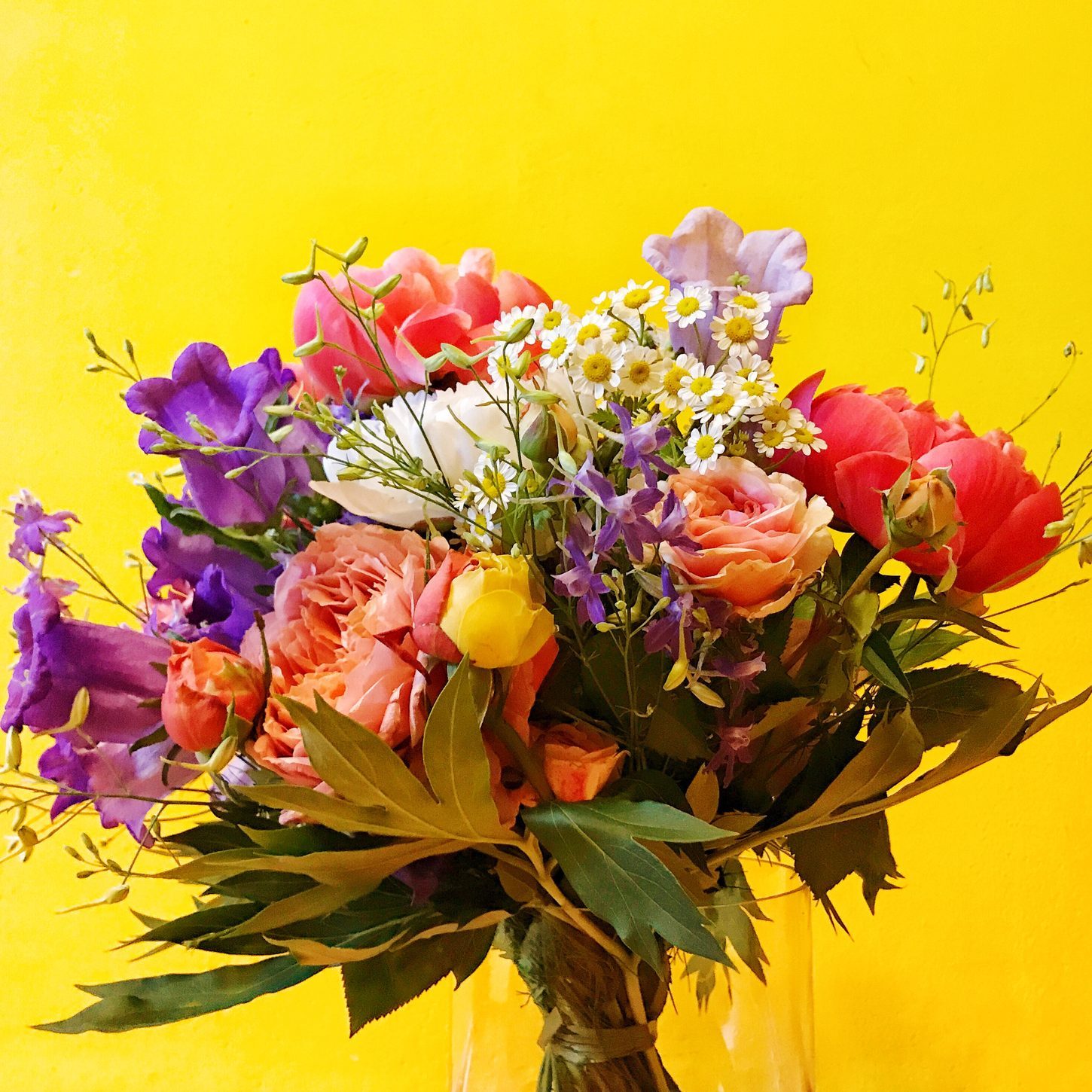 Close-Up Of Flower Bouquet Against Yellow Background