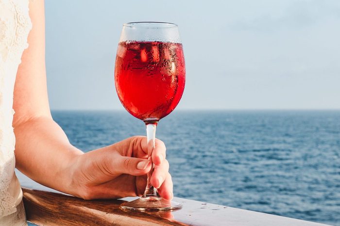 Woman holding a beautiful glass of pink wine