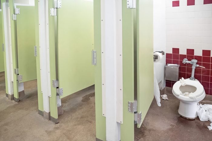 public bathroom stalls and one very dirty toilet
