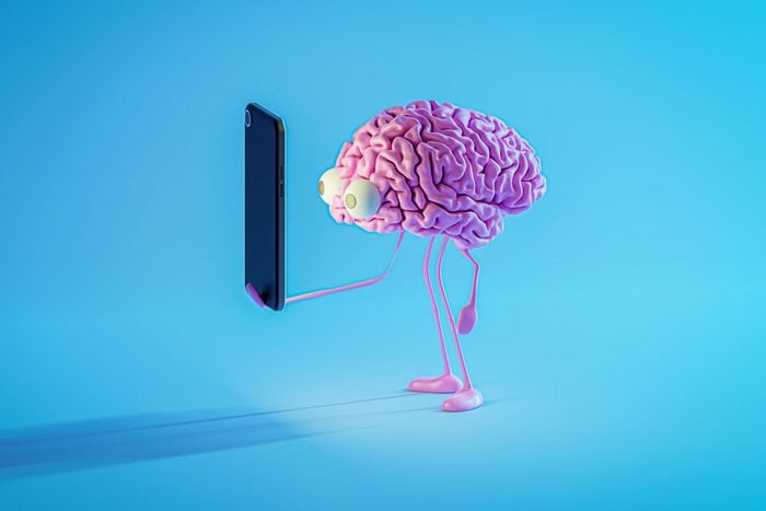 Pink brain looking at smartphone screen
