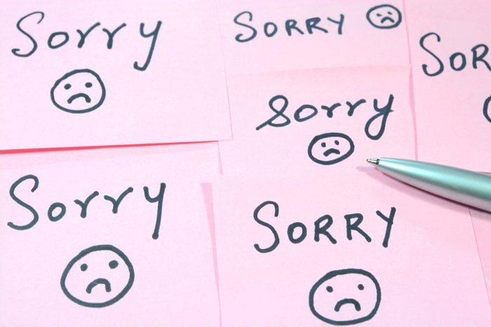 Sorry word written on adhesive sticky notes.