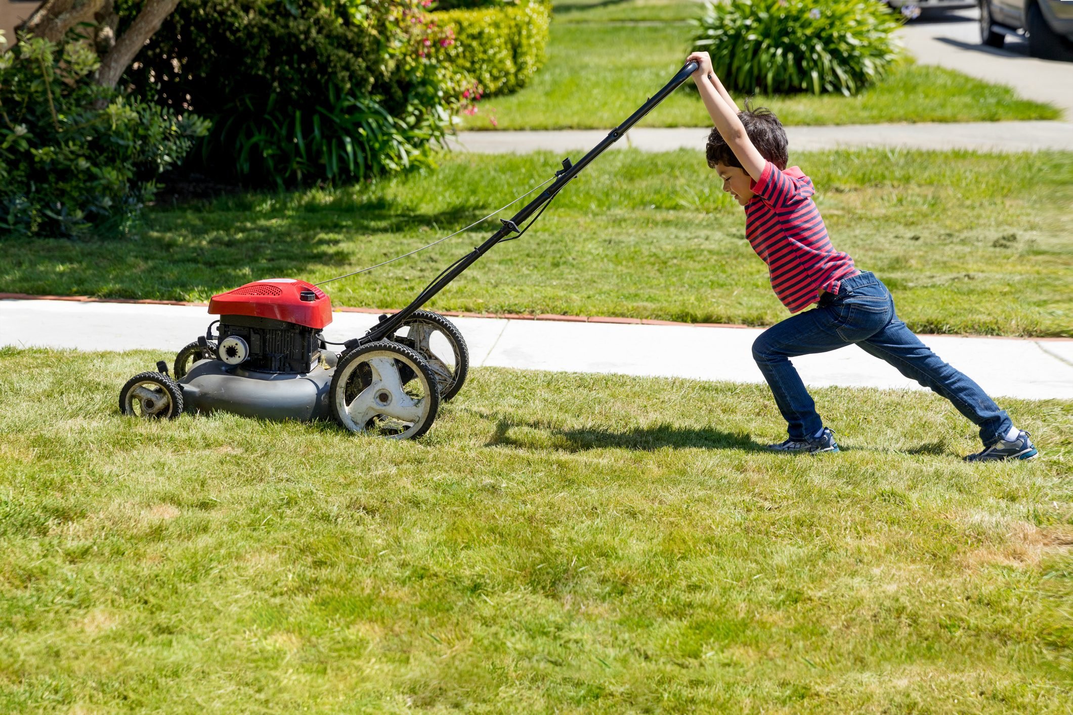 Macho Kid Mows Lawn with Lawnmower
