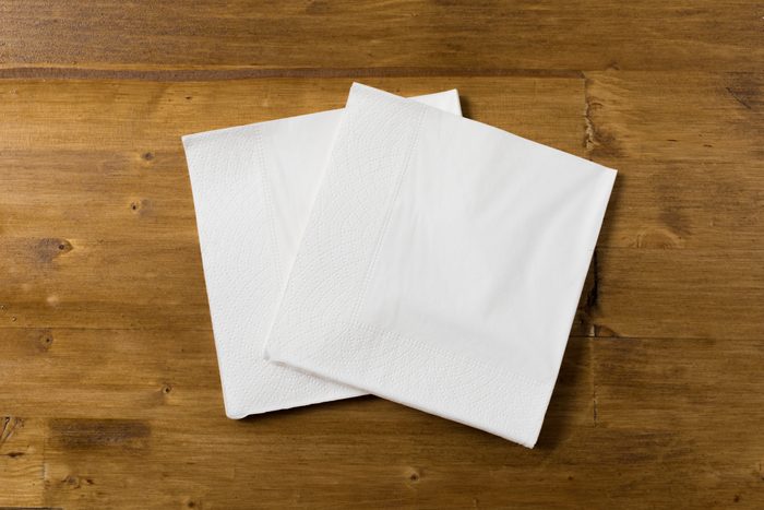 white paper napkin on wooden background