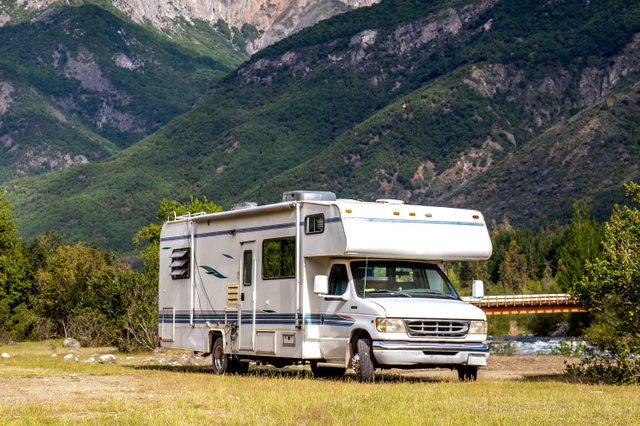 RV parked with beautiful mountain landscape in the background