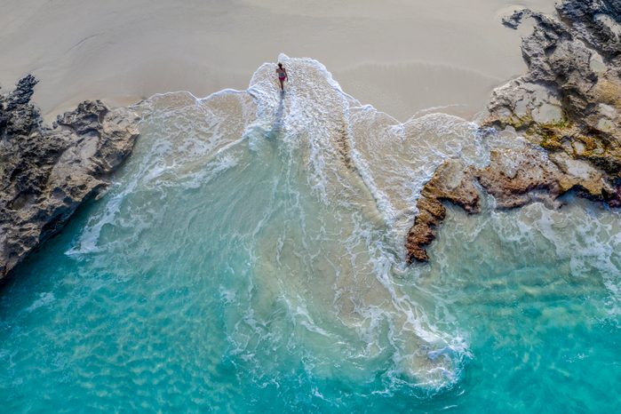 Aerial view of a woman walking out of the water_Little Exuma_Exuma_Bahamas