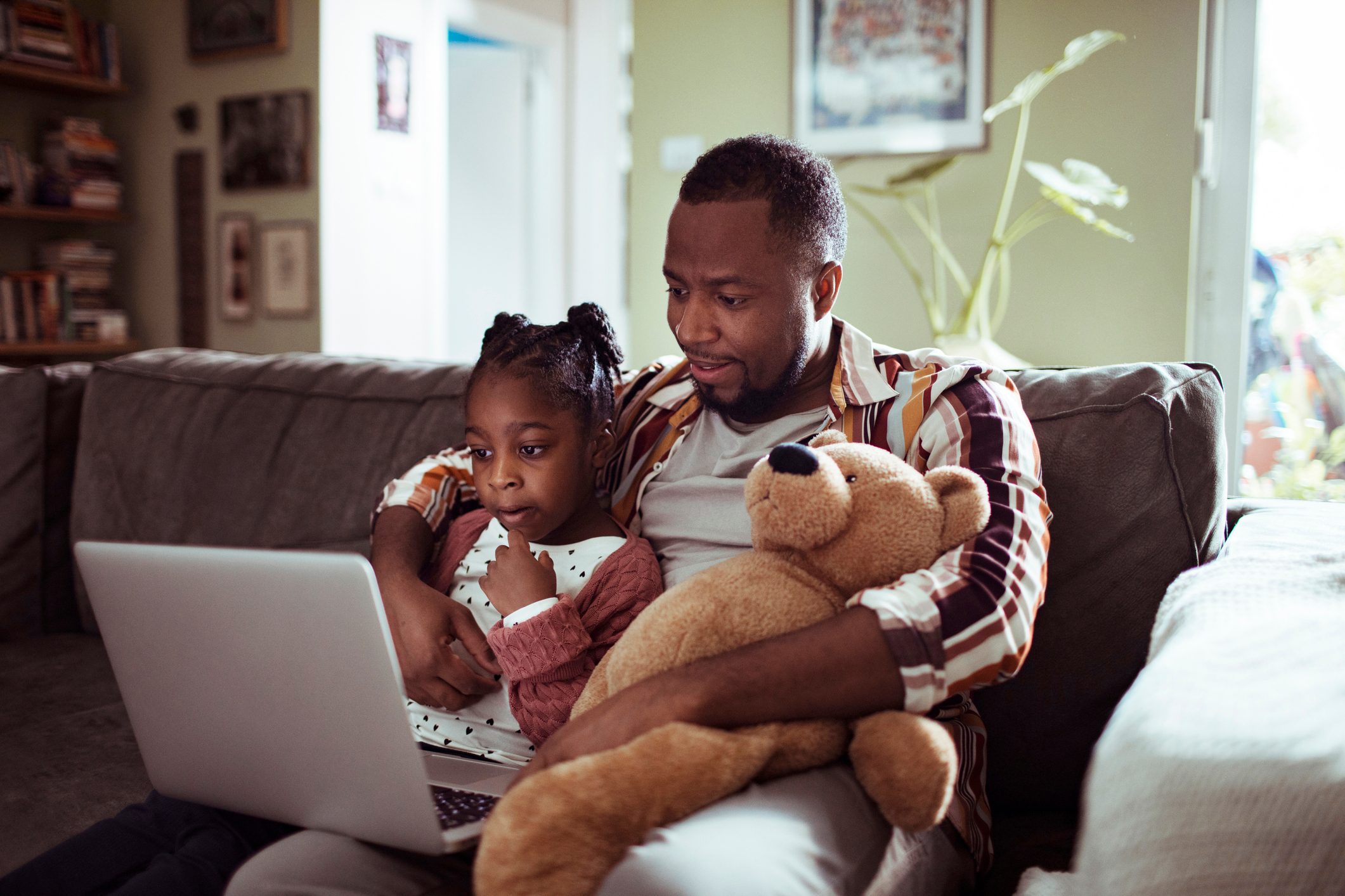 Father and Daughter using a Laptop