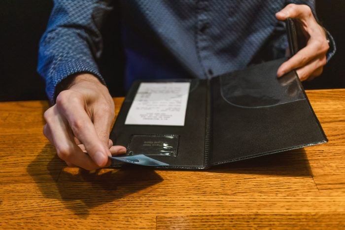 Man Pays Restaurant Bill with Credit Card