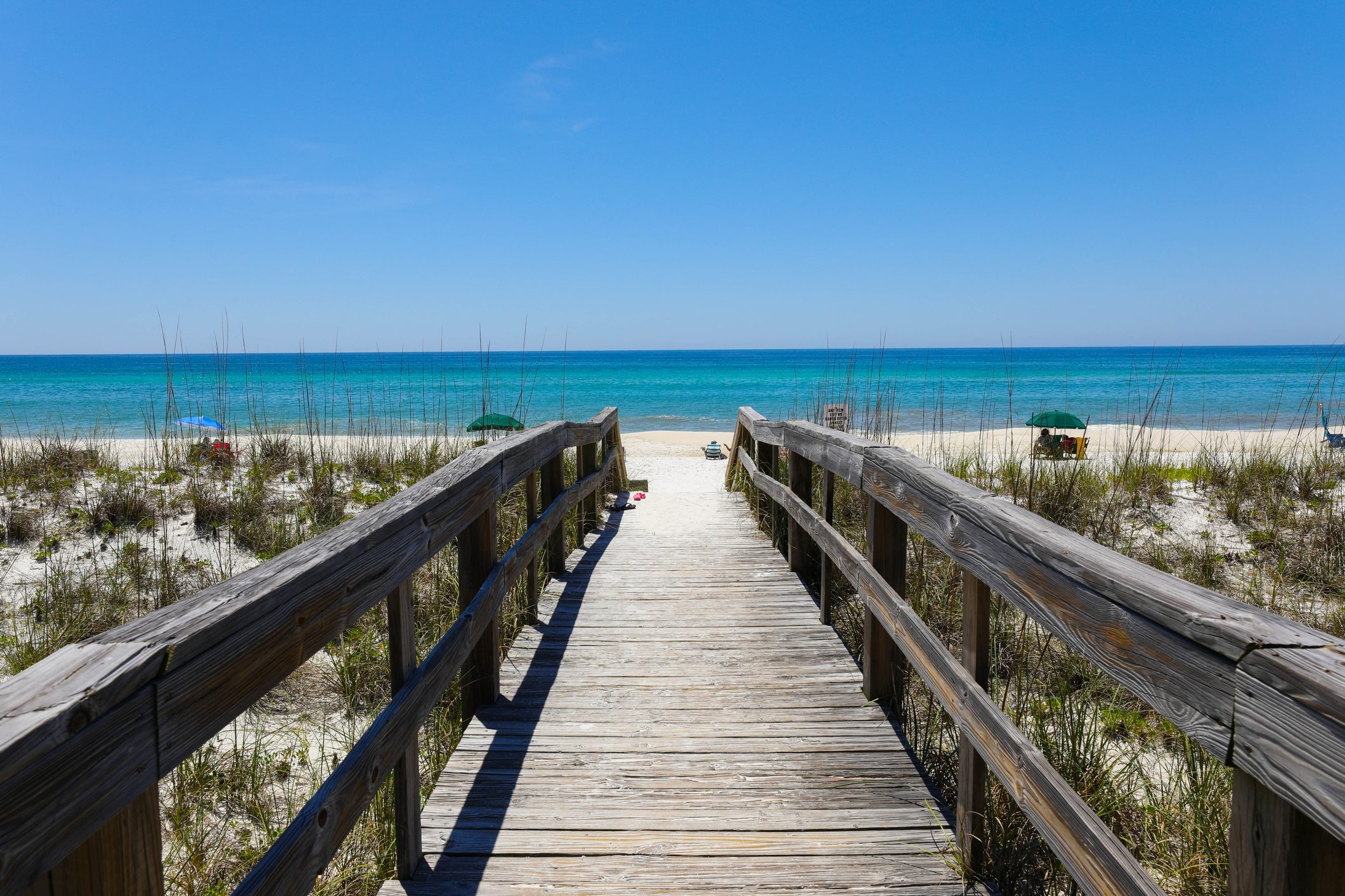 Beautiful view of a wooden path going to Henderson Beach State Park Destin in the USA