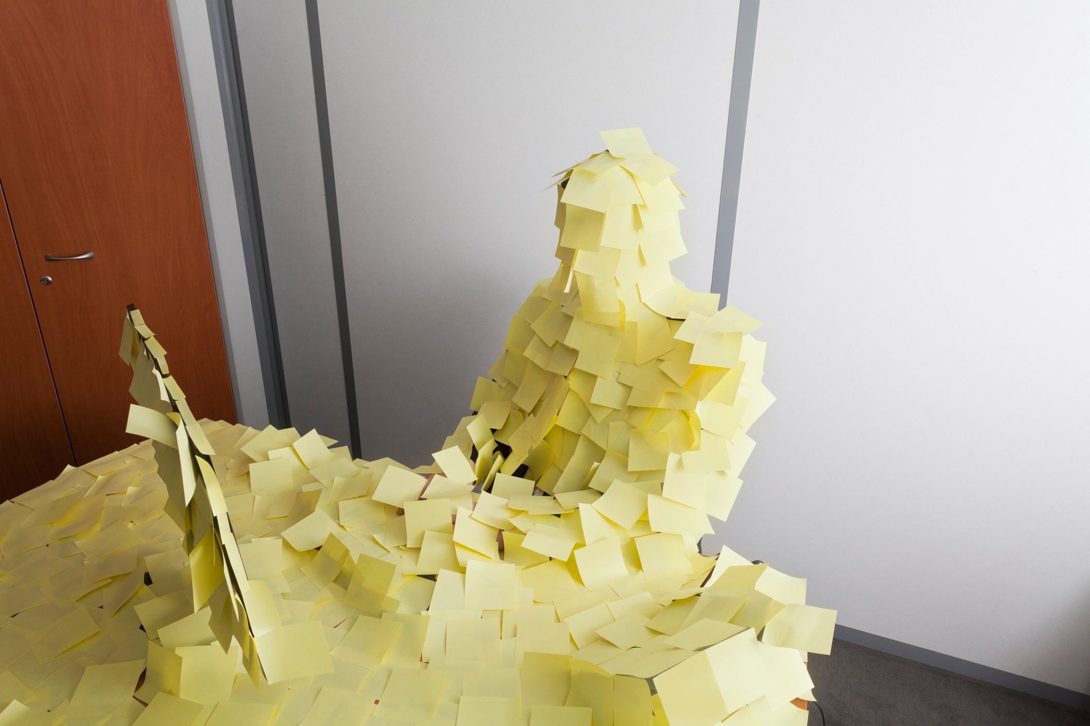 man covered by Post It