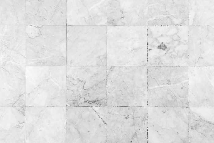 Close-up of a smooth marble floor viewed from above in black&white.