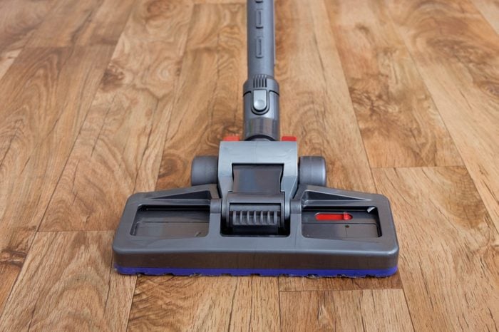 Vacuum cleaner used on parquet wooden floor