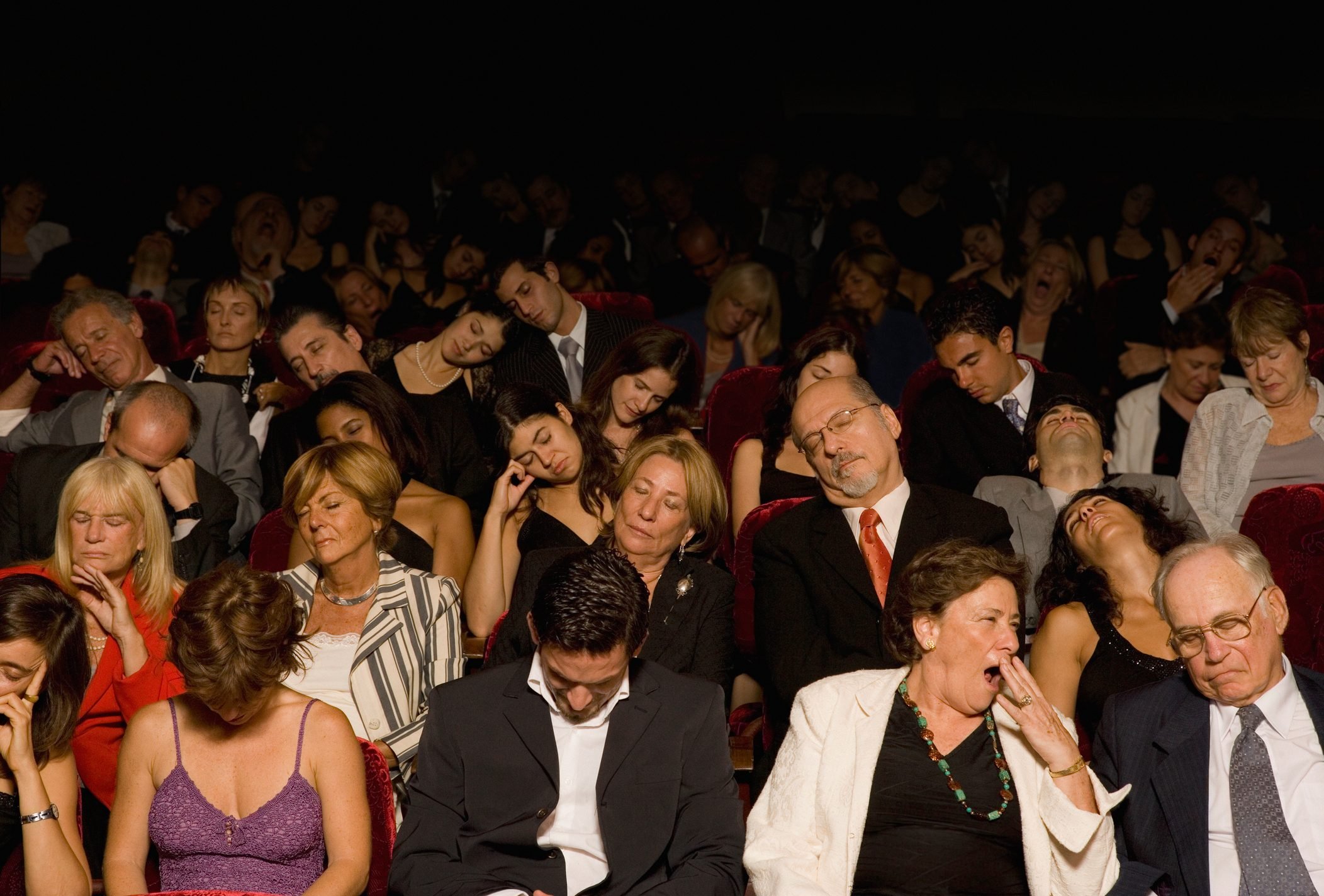 Hispanic people sleeping in theatre