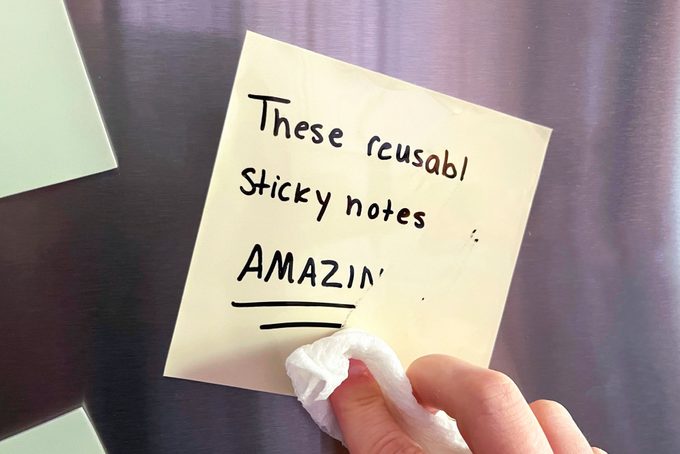 Reusable Sticky Note with text being wiped away