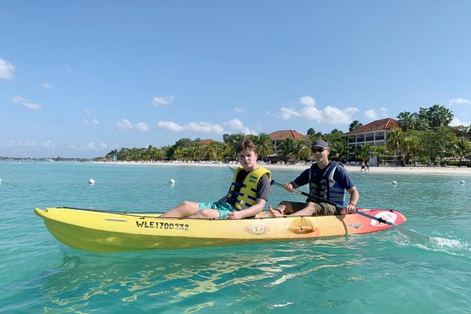two people on a kayak in turquoise blue waters