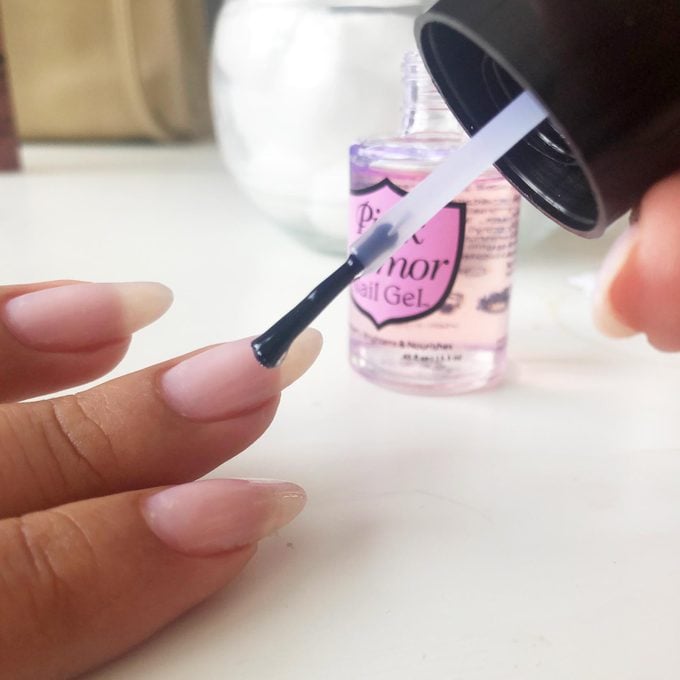 applying Pink Armor nail gel