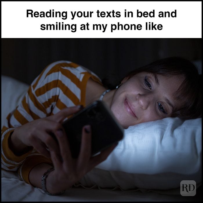 4 Reading Your Texts In Bed And Smiling At My Phone Like Gettyimages 1446465121