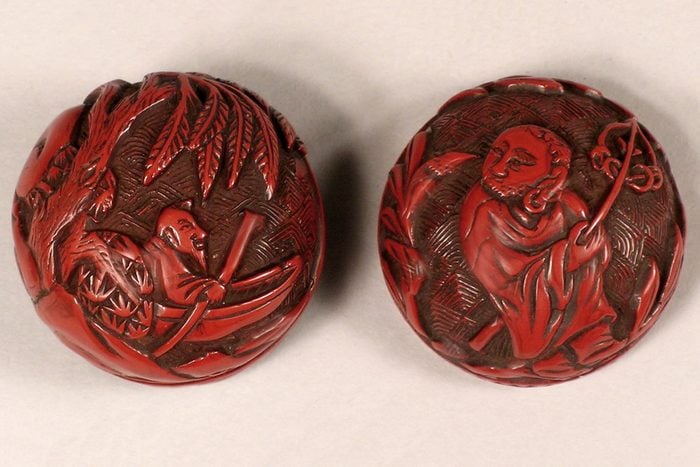 Carved red cinnabar lacquer box in the form of a Chinese football