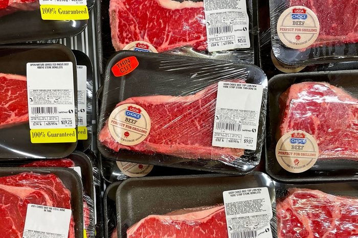 Beef steaks are displayed in the meat section at a Safeway store