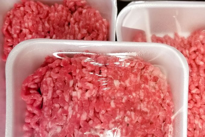 A variety of packages of ground beef at the supermarket