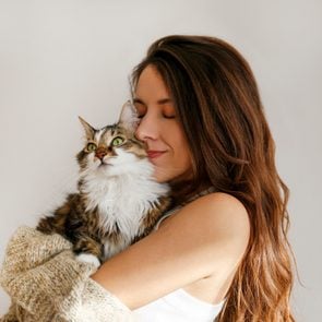 Young woman and her cat