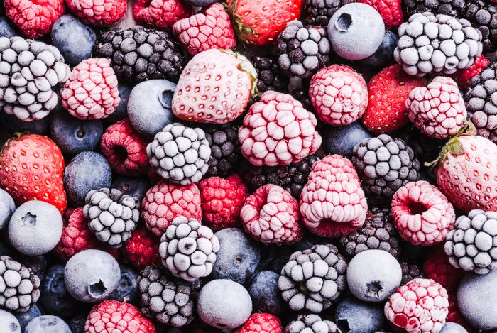 Frozen berries fruits background.