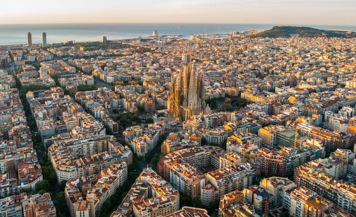 Sagrada Familia and Barcelona skyline at sunrise, aerial view. Catalonia, Spain