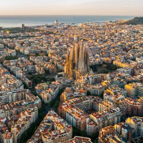 Sagrada Familia and Barcelona skyline at sunrise, aerial view. Catalonia, Spain