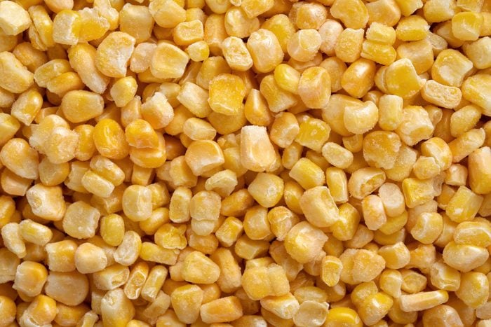 bulk of yellow corn grains texture macro