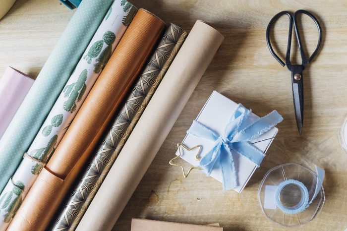 Wrapping paper with gifting material on desk