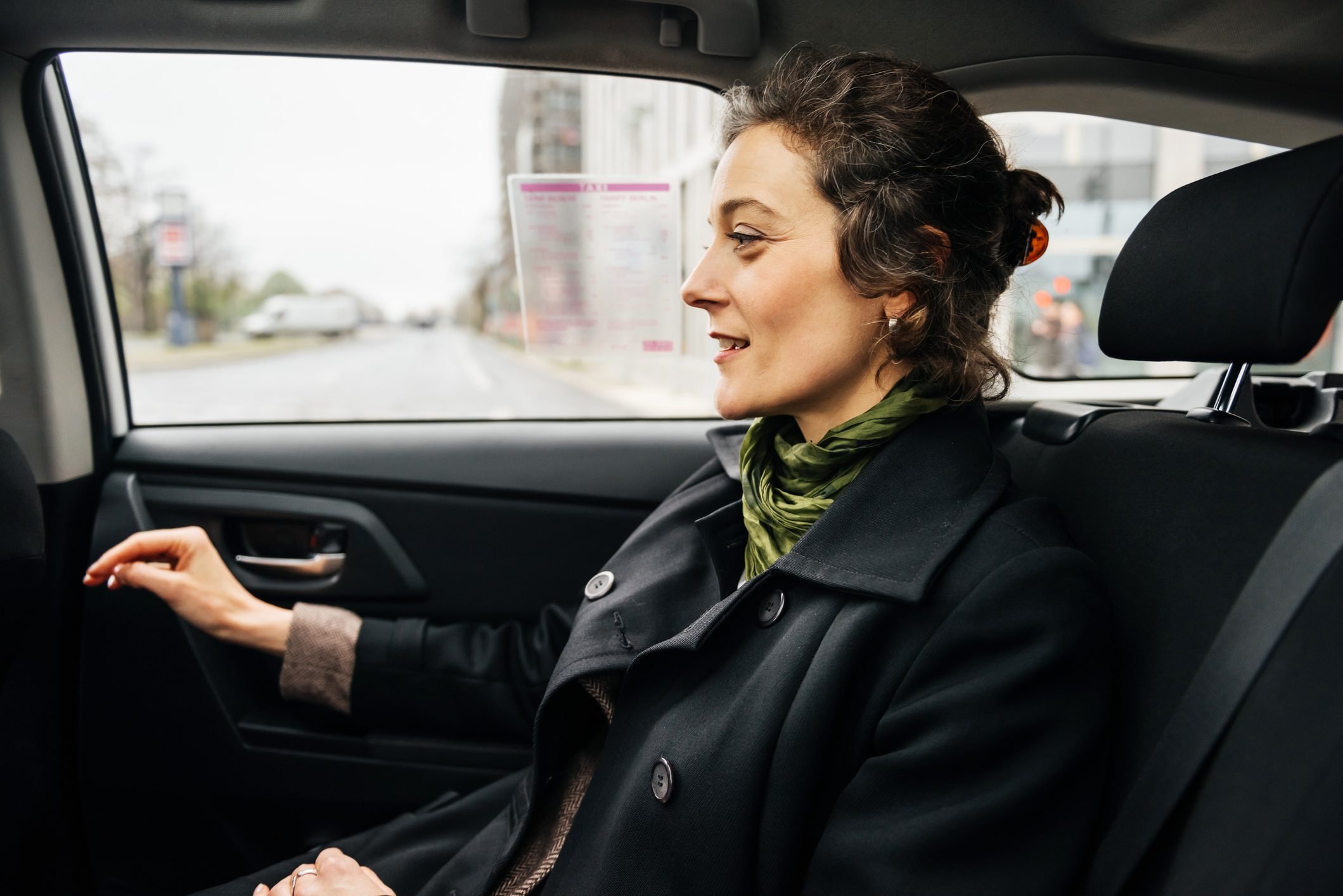 Mature Businesswoman travelling in Taxi
