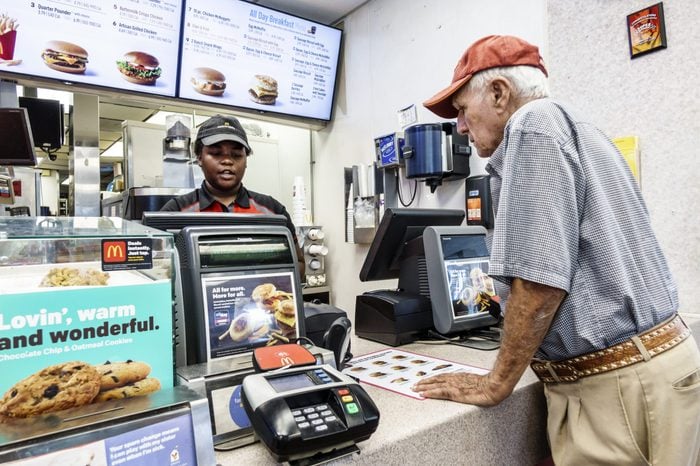 man ordering at McDonalds