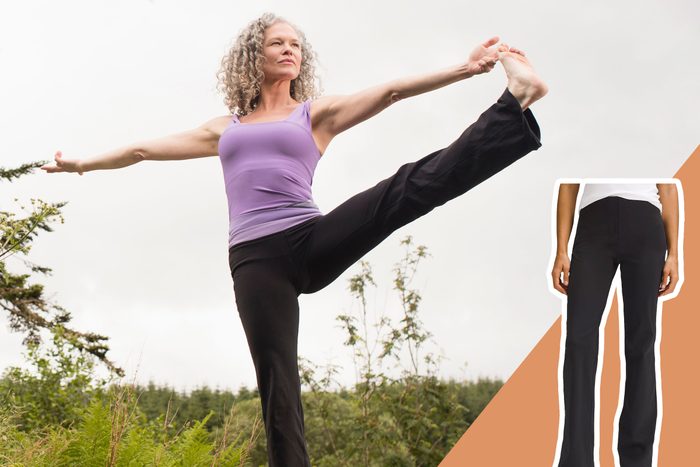 woman doing yoga and lifting herself in the air outside