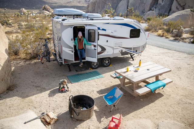Rv Camping in the desert with a picnic table and fire pit