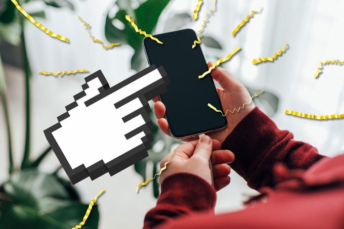 hands plugging in smartphone; over the image are strands of crinkled filler paper and a giant cursor hand